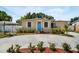 Delightful single-story home with white shutters, manicured landscaping, and a vibrant blue front door at 3115 Bay Ln, Clearwater, FL 33759