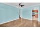 This living room features hardwood floors and views into the kitchen at 3115 Bay Ln, Clearwater, FL 33759