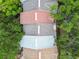 Overhead view of townhome roofs and lush tree coverage, highlighting the community's green landscape at 3308 W Wyoming Cir, Tampa, FL 33611
