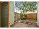 Cozy backyard featuring a wooden fence and a shade tree at 3308 W Wyoming Cir, Tampa, FL 33611