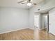 This bedroom features a ceiling fan, neutral paint, and doorway to bath at 3308 W Wyoming Cir, Tampa, FL 33611