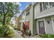 Townhouse exterior with colorful facade and landscaping at 3308 W Wyoming Cir, Tampa, FL 33611