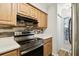Stylish kitchen showcasing stainless steel appliances, modern countertops and plenty of cabinet space at 3308 W Wyoming Cir, Tampa, FL 33611