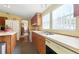 Kitchen with lots of cabinets and neutral countertops allowing efficient meal preparation at 4537 Thornton Dr, Zephyrhills, FL 33542