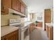 Kitchen featuring lots of cabinets, white countertops and an open design enhancing cooking convenience at 4537 Thornton Dr, Zephyrhills, FL 33542