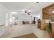Comfortable living room with neutral carpet, ceiling fan and classic design touches for relaxed living at 4537 Thornton Dr, Zephyrhills, FL 33542