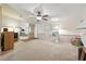 Inviting living room featuring neutral carpet and a spacious layout perfect for comfortable living at 4537 Thornton Dr, Zephyrhills, FL 33542
