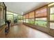 Bright sunroom filled with lots of windows providing natural light and lovely views of the outdoors at 4537 Thornton Dr, Zephyrhills, FL 33542