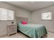 Clean bedroom featuring tile floors, bright windows, and a comfortable bed at 4727 Town N Country Blvd, Tampa, FL 33615