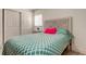 Bright bedroom features a patterned comforter, carved headboard and a closet at 4727 Town N Country Blvd, Tampa, FL 33615