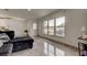 Bright living room with a view of the exterior, featuring tile floors and contemporary furnishings at 4727 Town N Country Blvd, Tampa, FL 33615
