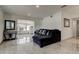 Living room featuring tile floors, contemporary furnishings, and a bright, open space at 4727 Town N Country Blvd, Tampa, FL 33615
