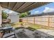 Cozy backyard featuring a covered patio, fenced yard, a shed for extra storage, and a tranquil ambiance at 5414 Oceanic Rd, Holiday, FL 34690