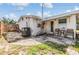 Outdoor patio area, perfect for relaxing, with seating, a well-maintained stone surface, and partially grassy yard at 5414 Oceanic Rd, Holiday, FL 34690
