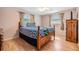 Bedroom with hardwood floors, a ceiling fan, and a large window at 5414 Oceanic Rd, Holiday, FL 34690