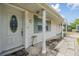 Charming front porch with decorative columns, a well-maintained walkway, and a welcoming entryway at 5414 Oceanic Rd, Holiday, FL 34690