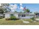 Charming single-story home featuring a well-maintained lawn and welcoming facade at 5414 Oceanic Rd, Holiday, FL 34690
