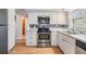 Modern kitchen cabinets and stainless steel appliances at 5414 Oceanic Rd, Holiday, FL 34690