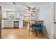 Open kitchen with a ceiling fan overlooking a dining area and living room at 5414 Oceanic Rd, Holiday, FL 34690