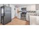 Modern kitchen equipped with stainless steel appliances and lots of cabinet storage at 5414 Oceanic Rd, Holiday, FL 34690