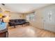 Comfortable living room with laminate floors, natural light, and a cozy atmosphere at 5414 Oceanic Rd, Holiday, FL 34690