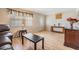 Inviting living area featuring laminate floors, natural light, and traditional decor at 5414 Oceanic Rd, Holiday, FL 34690