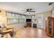 Comfortable living room with hardwood floors, ceiling fan, and natural light at 5414 Oceanic Rd, Holiday, FL 34690