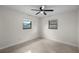 Bright bedroom with two windows and neutral walls, offering a serene and adaptable space at 5627 57Th N Ave, St Petersburg, FL 33709