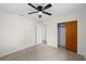A Bedroom showcasing ample natural light, ceiling fan, closet, and a clean neutral color palette at 5627 57Th N Ave, St Petersburg, FL 33709