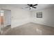 Bright bedroom features a ceiling fan, window and neutral color palette at 5627 57Th N Ave, St Petersburg, FL 33709