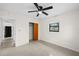 A bedroom featuring a ceiling fan, window, closet, and neutral color palette at 5627 57Th N Ave, St Petersburg, FL 33709