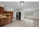 Kitchen with wood cabinets and an open layout into the dining and living spaces at 5627 57Th N Ave, St Petersburg, FL 33709