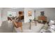 Bright living room featuring stylish furniture, neutral tones, and views into dining and kitchen at 5627 57Th N Ave, St Petersburg, FL 33709