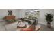 Bright living room features an abundance of natural light, stylish furniture, and open floorplan at 5627 57Th N Ave, St Petersburg, FL 33709