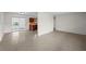 Expansive living room featuring polished floors and an open layout into the kitchen at 5627 57Th N Ave, St Petersburg, FL 33709