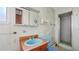 Bathroom with a vanity, toilet, and a shower with white tiles at 5631 23Rd S Ave, Gulfport, FL 33707