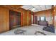 The bedroom features wood paneling, a ceiling fan, and access to a closet for storage at 5631 23Rd S Ave, Gulfport, FL 33707
