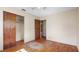 Bedroom featuring hardwood floors, a ceiling fan, and closet space at 5631 23Rd S Ave, Gulfport, FL 33707