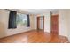 Bedroom featuring hardwood floors, closet, and natural light from the window at 5631 23Rd S Ave, Gulfport, FL 33707