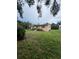 Charming single-story home featuring a screened porch, mature trees, and a spacious front yard at 5631 23Rd S Ave, Gulfport, FL 33707