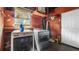 Laundry room with a washer, dryer, window and storage shelves at 5631 23Rd S Ave, Gulfport, FL 33707