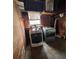A laundry room featuring a washer and dryer set, with storage shelves above at 5631 23Rd S Ave, Gulfport, FL 33707