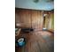 Cozy living room with wood-paneled walls and floors, creating a rustic and inviting space at 5631 23Rd S Ave, Gulfport, FL 33707