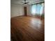 Spacious living room with hardwood floors, ceiling fan, offering a warm and inviting atmosphere at 5631 23Rd S Ave, Gulfport, FL 33707