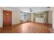Bright living room with wood floors, a ceiling fan, and ample natural light from multiple windows at 5631 23Rd S Ave, Gulfport, FL 33707