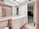 Clean bathroom with a big mirror, shower with glass doors and vanity storage at 5870 38Th N Ave # 44, St Petersburg, FL 33710