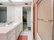Cozy bathroom featuring white sink, vanity, and a glass-enclosed shower at 5870 38Th N Ave # 44, St Petersburg, FL 33710