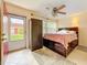 Cozy bedroom featuring a bed with storage, ceiling fan, and tile flooring at 5870 38Th N Ave # 44, St Petersburg, FL 33710