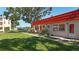 Charming single-story home with a vibrant red roof and well-maintained lawn at 5870 38Th N Ave # 44, St Petersburg, FL 33710