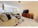 Inviting living room with neutral décor, tile flooring, and a cozy seating arrangement at 5870 38Th N Ave # 44, St Petersburg, FL 33710
